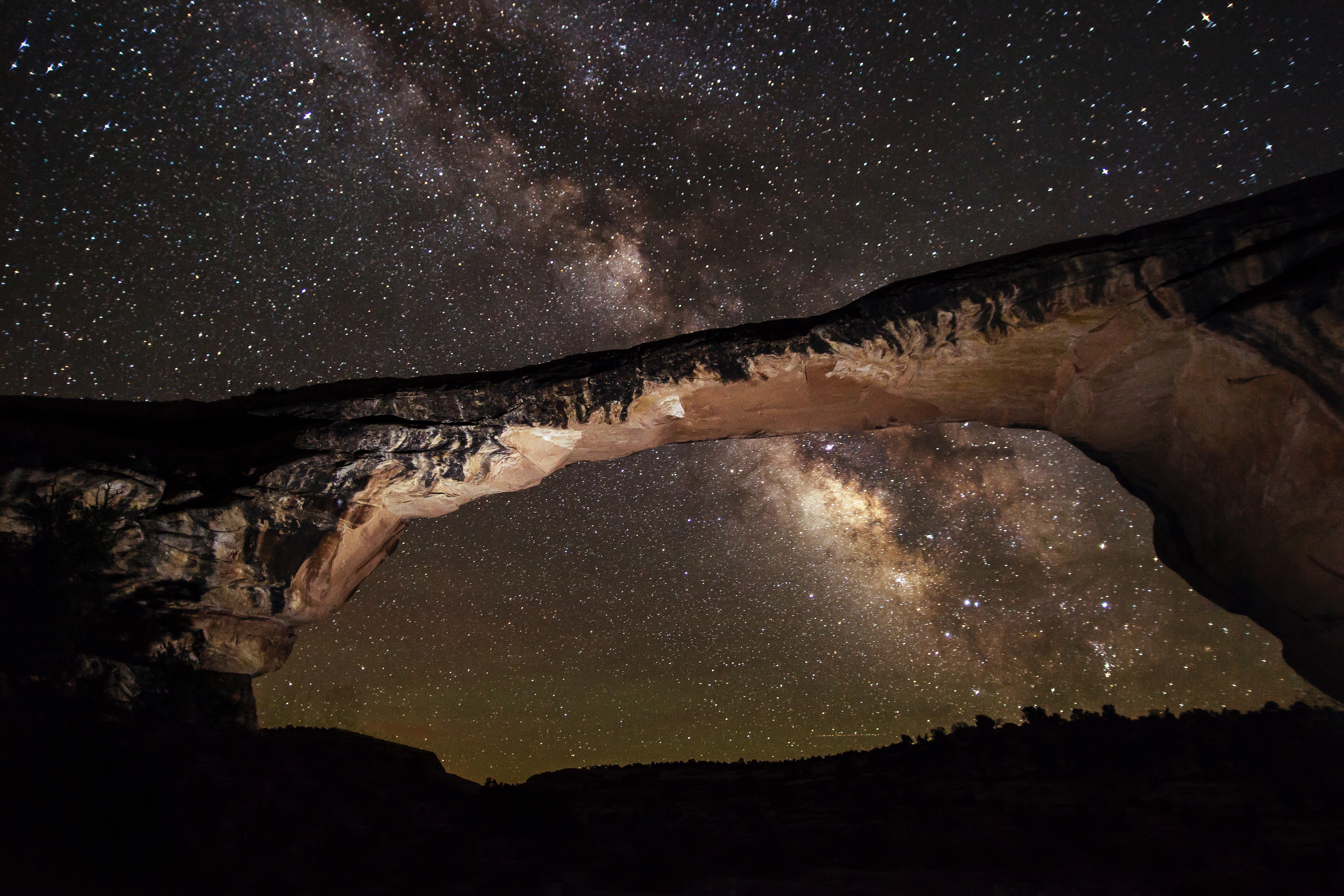 Stars and the Milky Way visible above Owachomo Bridge at Natural Bridges National Monument, Utah, the world's first International Dark Sky Park