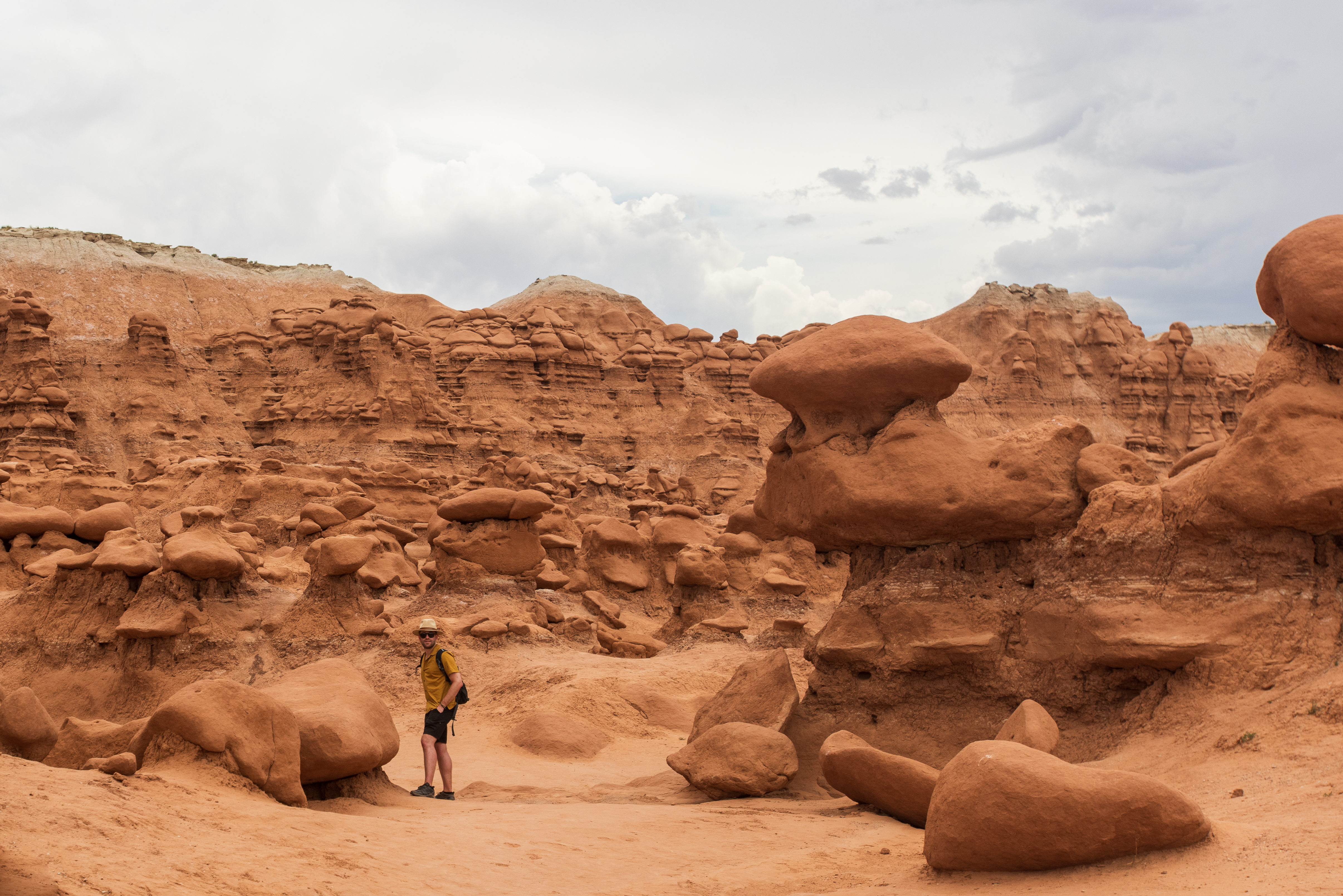 Thousands of rounded Entrada Sandstone hoodoo formations scattered across the floor of Goblin Valley State Park under a blue sky