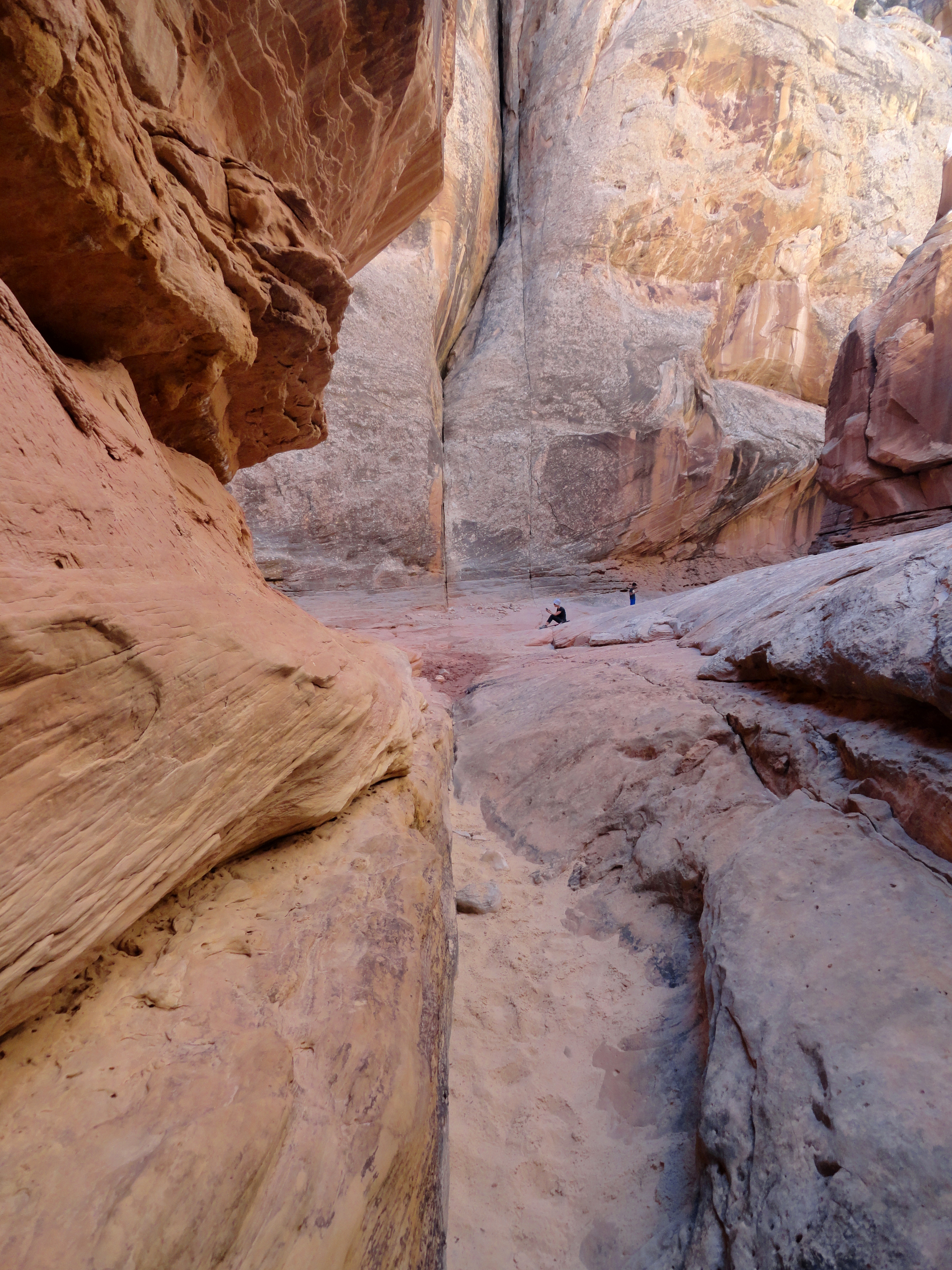 Narrow slot canyon passage in Little Wild Horse Canyon, San Rafael Swell, with Entrada Sandstone walls pressed close on both sides